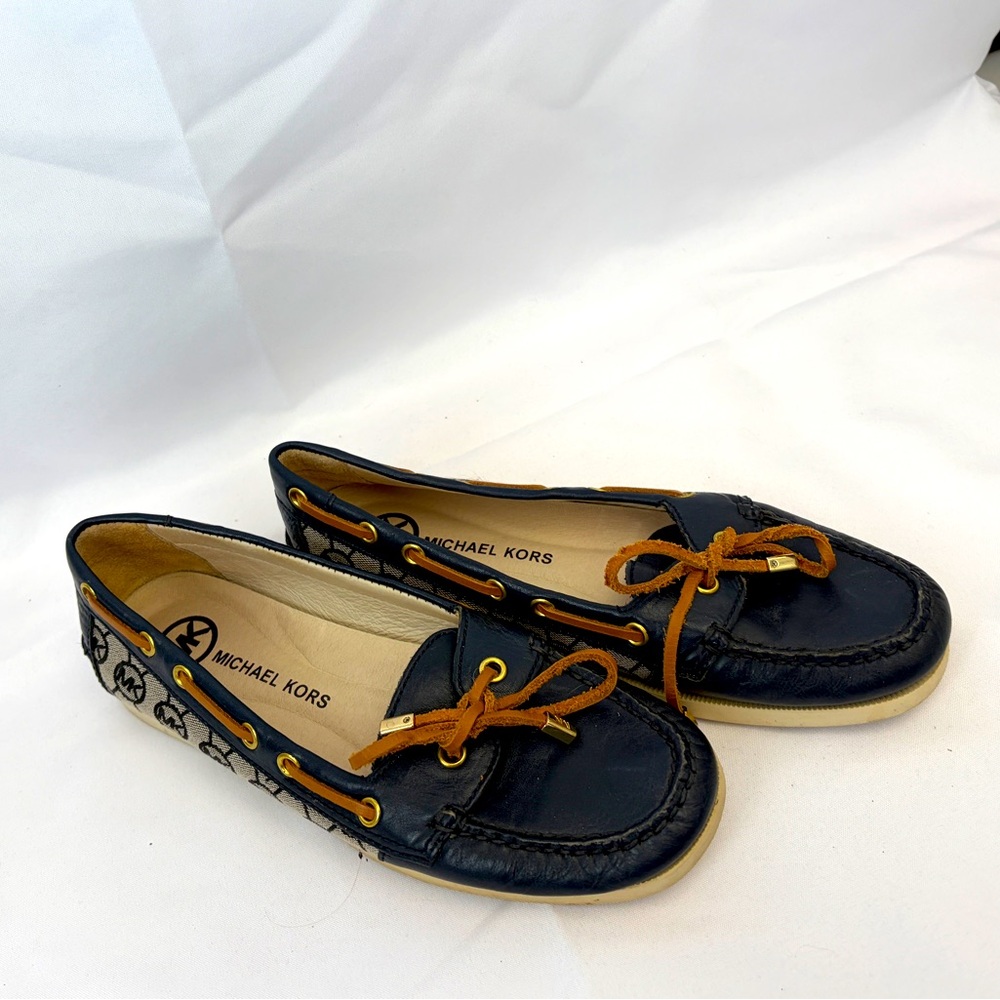 Navy and white boat shoes with leather ties